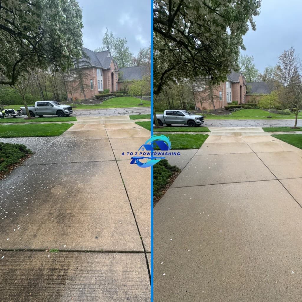 before and after driveway concrete cleaning in West Bloomfield Michigan stained driveway restored in front of brick home by A to Z Power Washing
